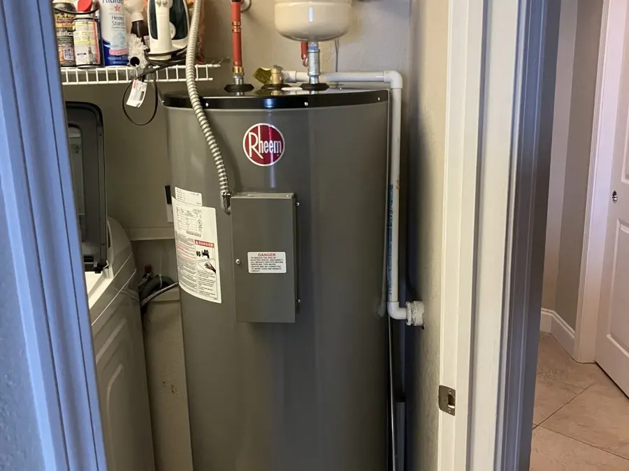 Rheem water heater in a closet with new piping