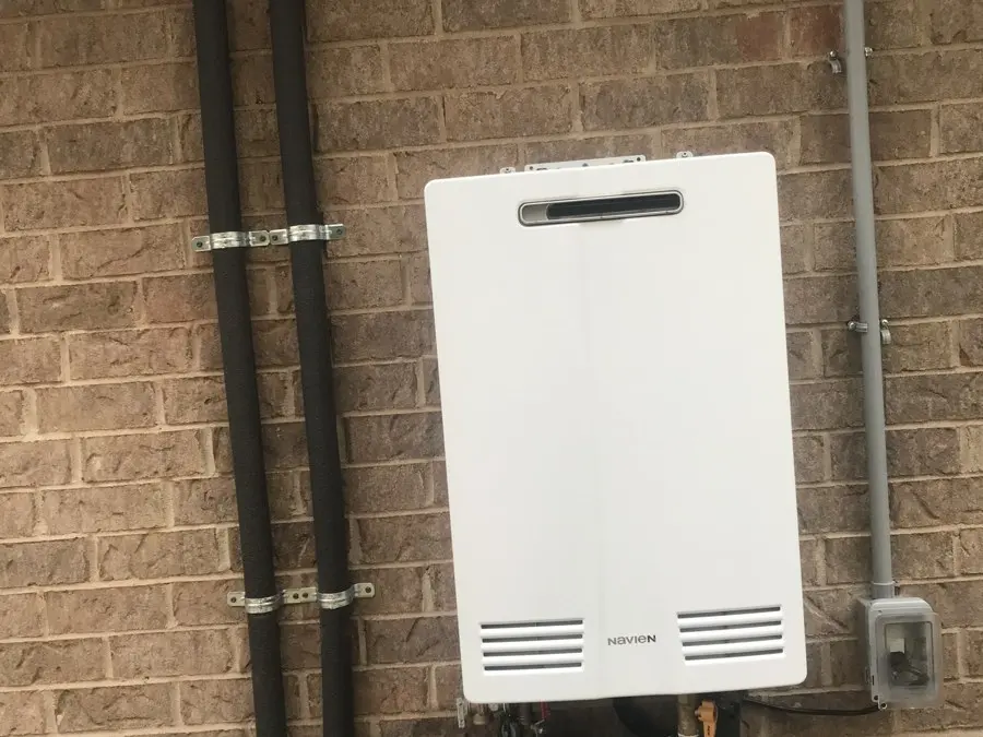 Tankless water heater on a brick wall
